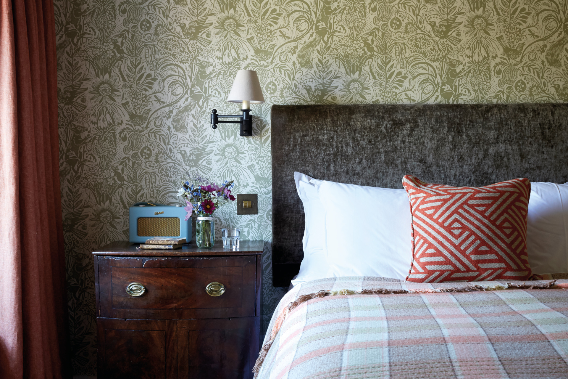 Bedroom with green floral wallpaper