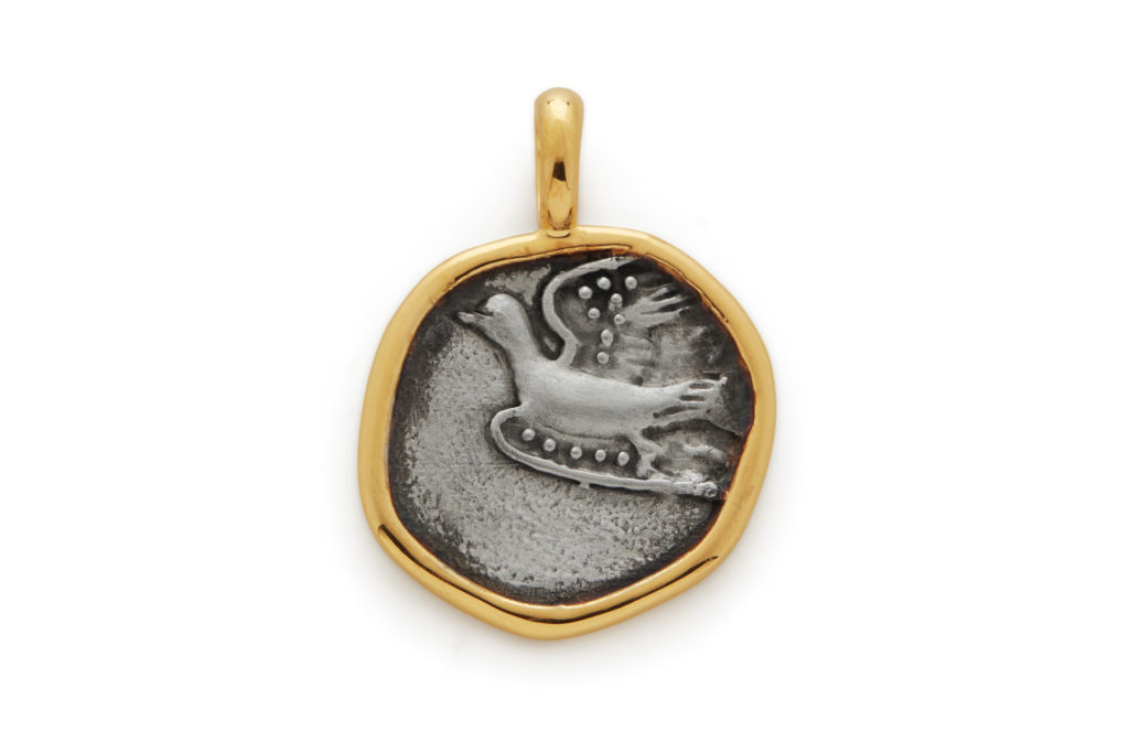 Pendant with a dove symbol
