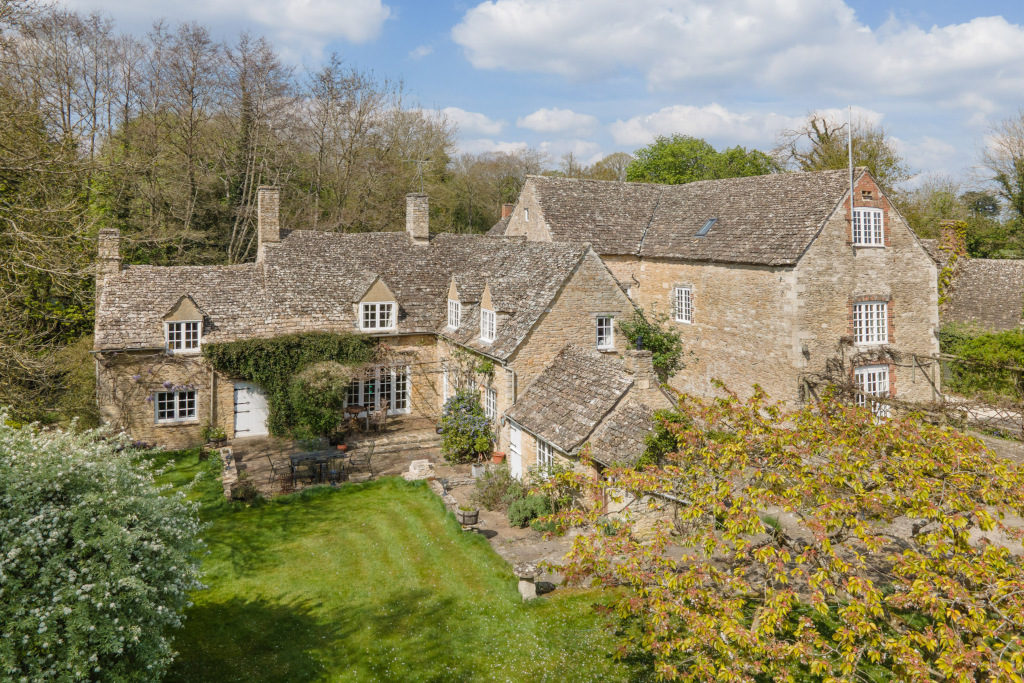 mill house countryside cotswold stone with garden and shrubbery