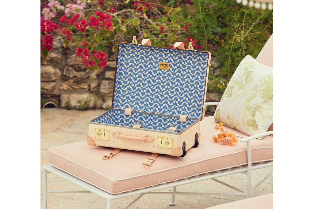 Trolley case on pink sun lounger