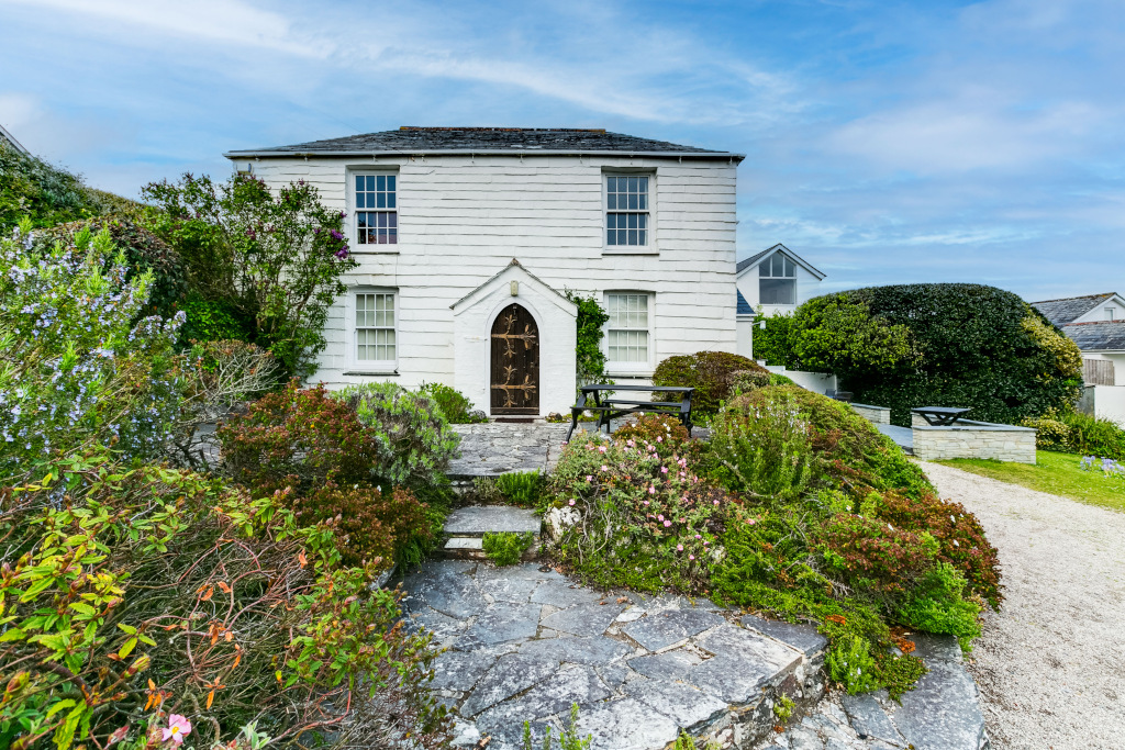 cornish white farm house with paving and garden