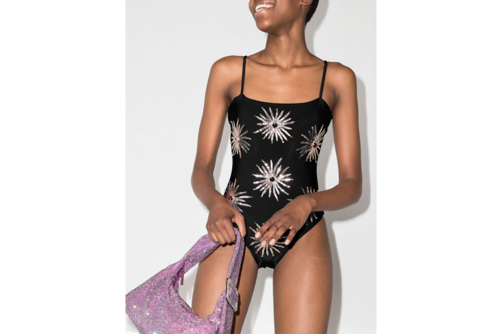 Model in black sequined swimming costume