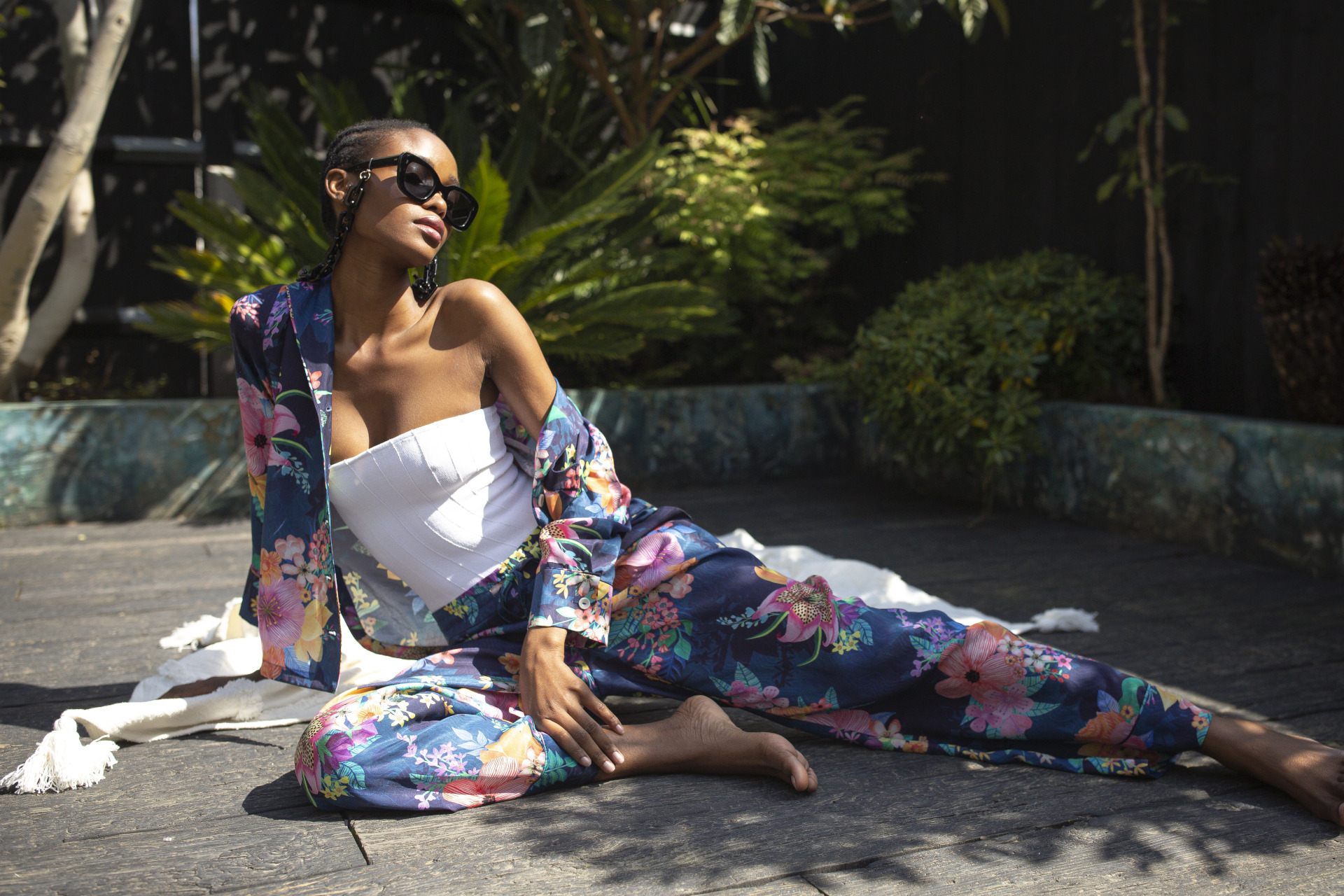 Model in vegan silk pyjamas sat in the sun | vegan fashion brands