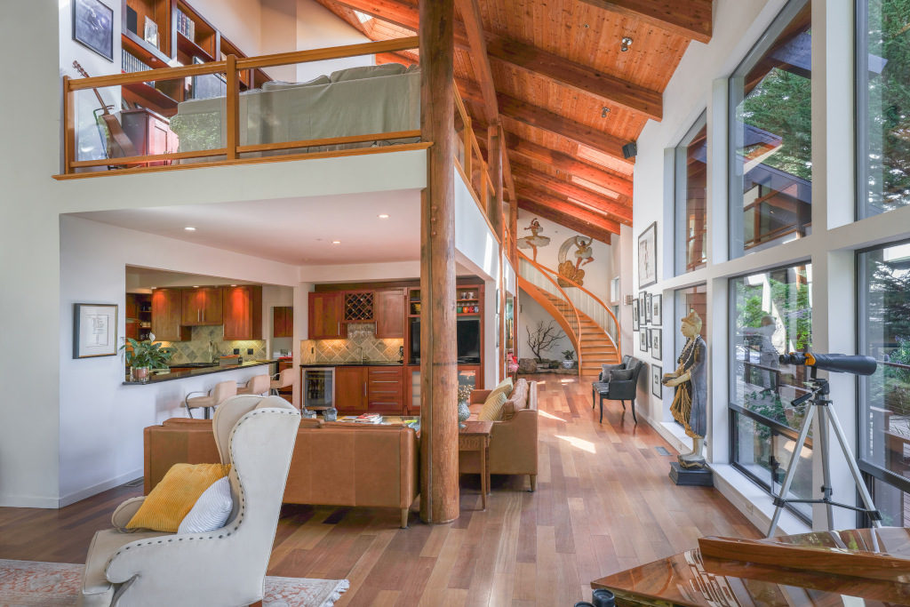cool contemporary californian house with galleried sitting room and wooden vaulted roof