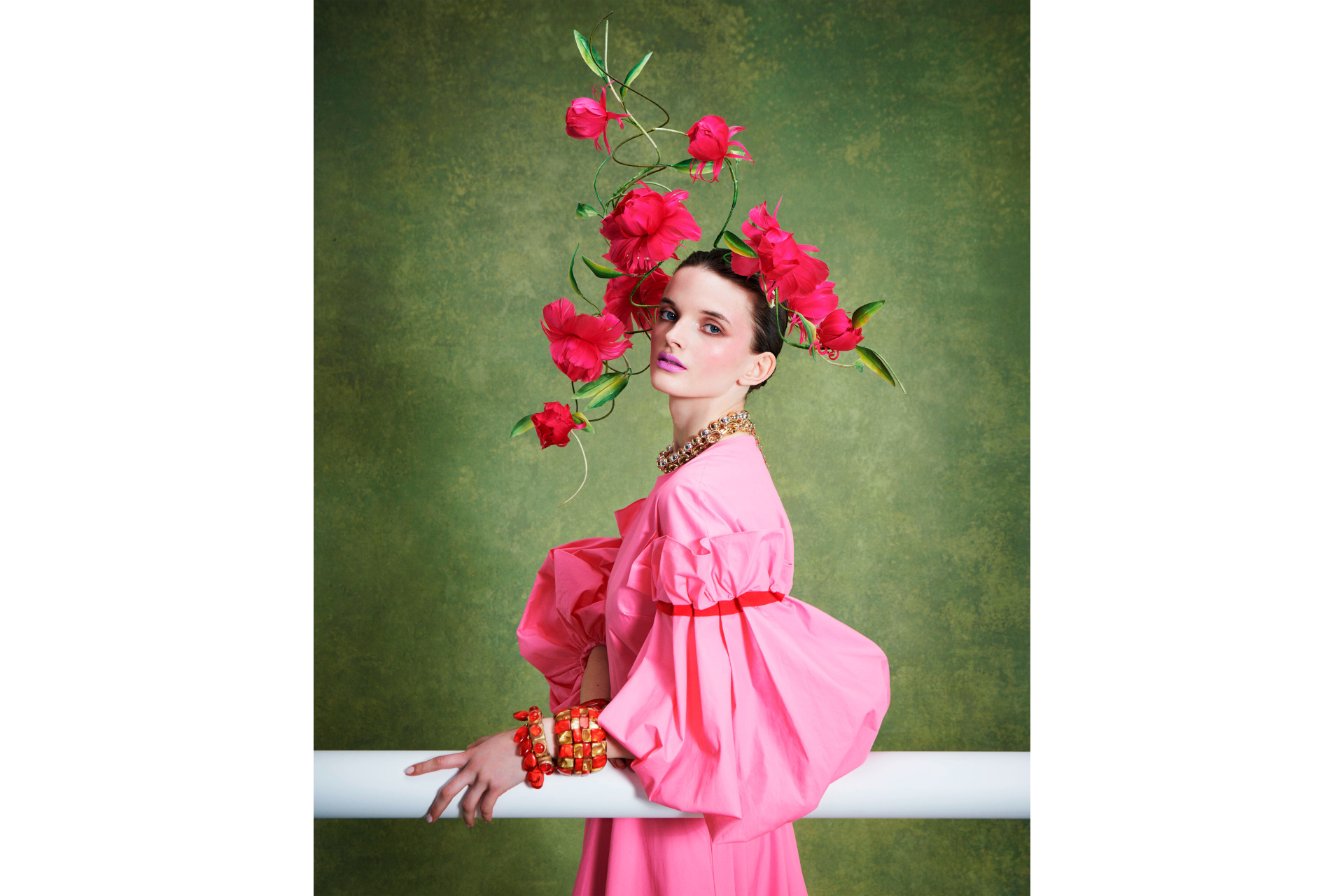 Woman in pink dress with floral headpiece
