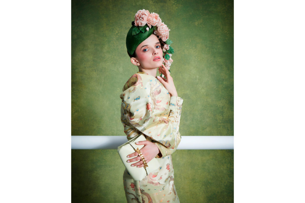 Woman wearing floral headpiece and patterned dress