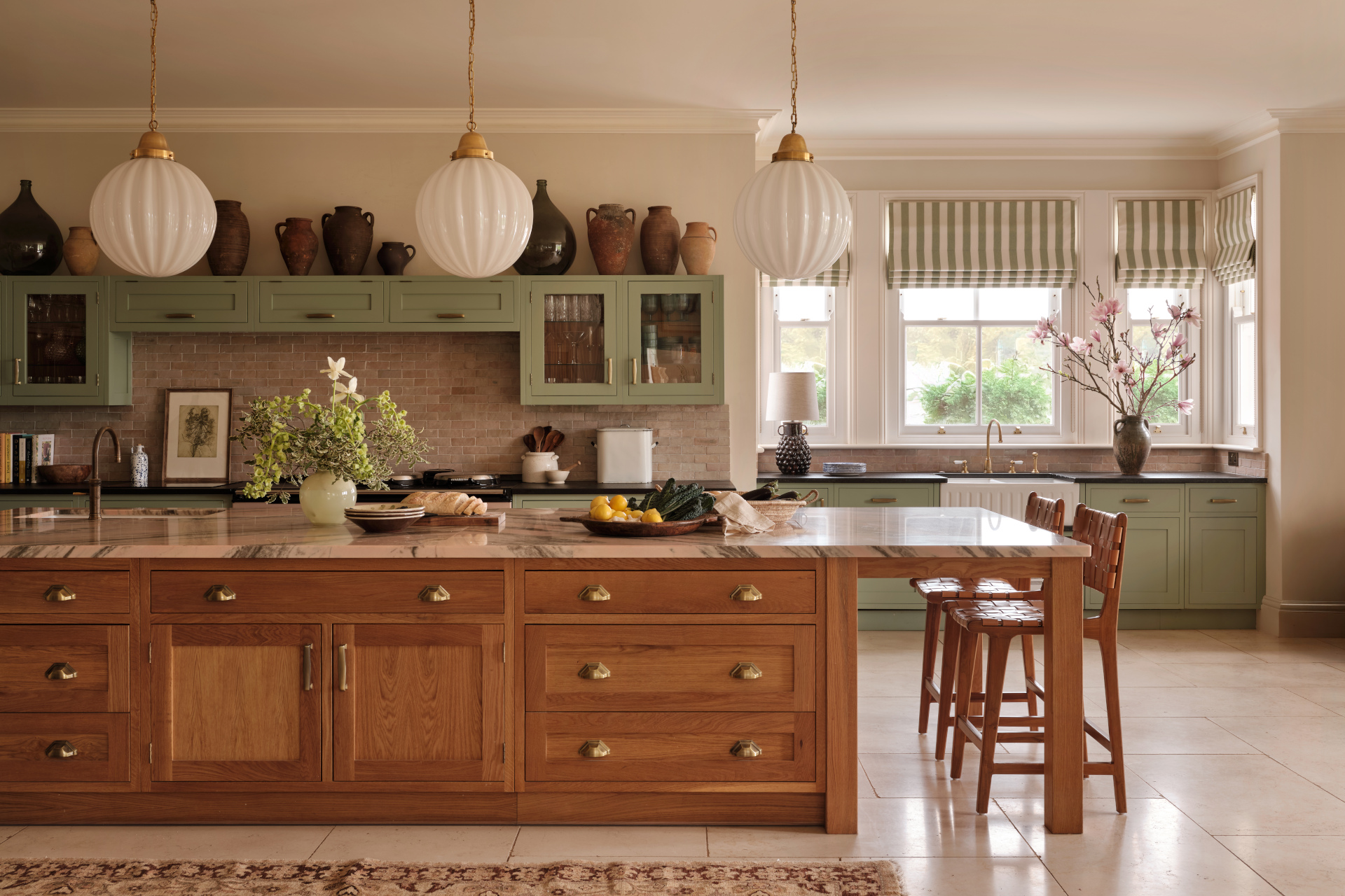 Kitchen with natural wood and painted green cabinets