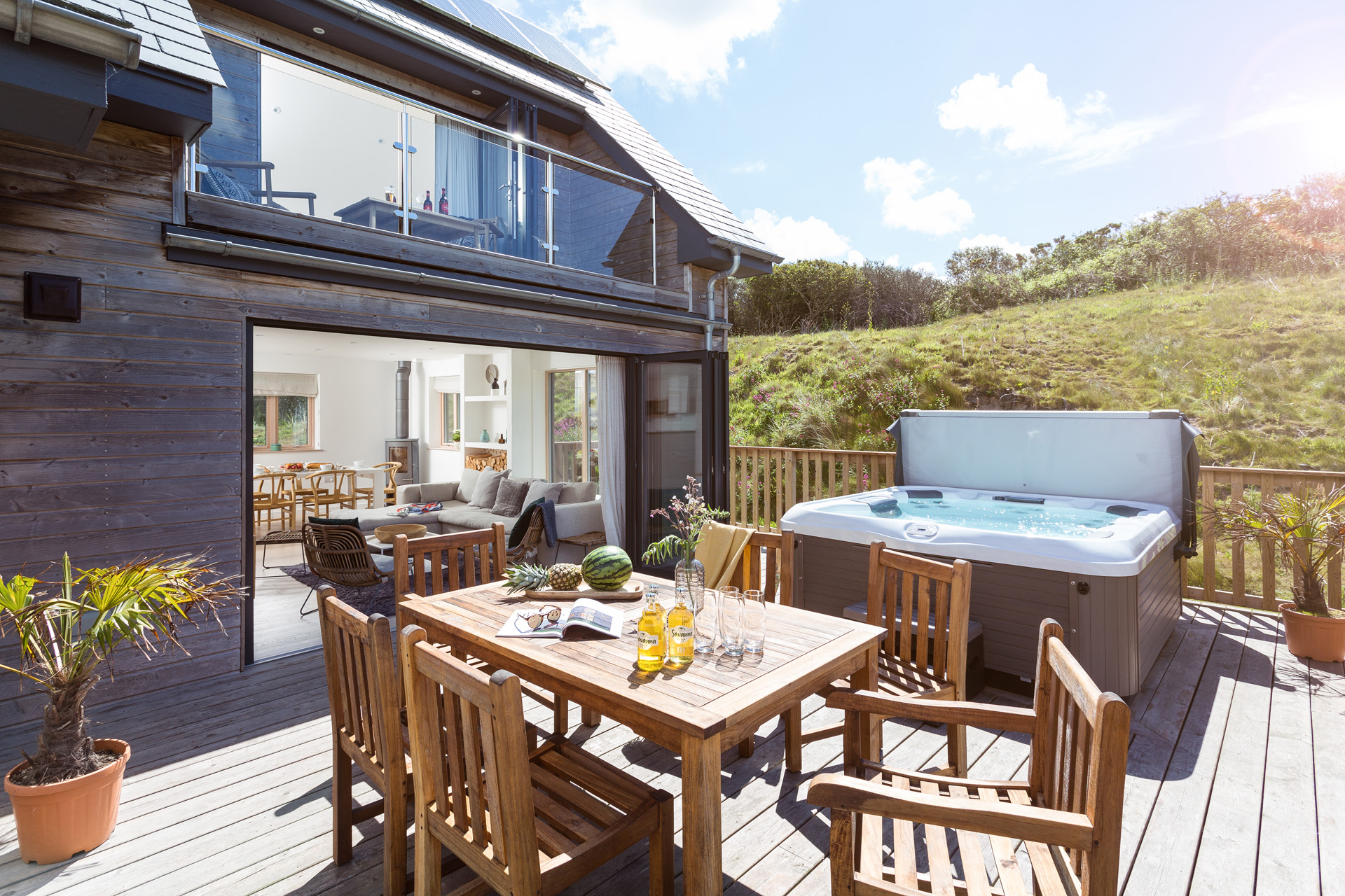 A modern property with hottub and outdoor dining