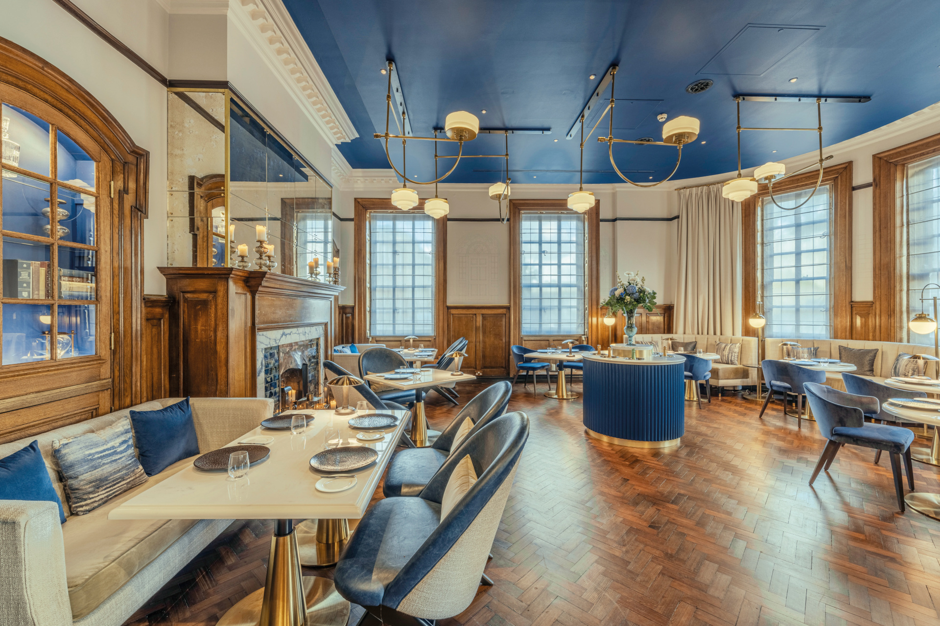 Dining room with blue chairs and ceilings