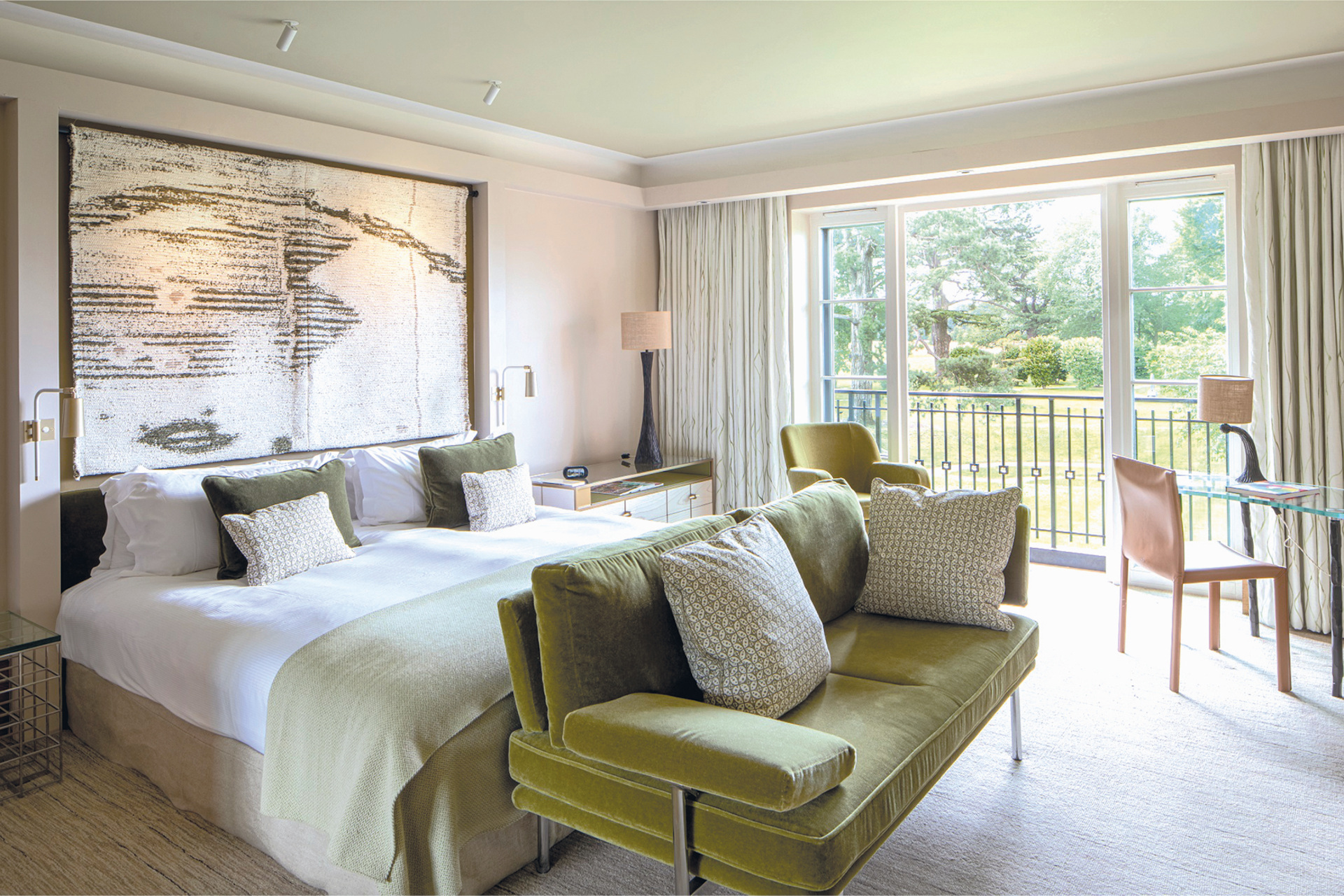 Bedroom with balcony and green sofa
