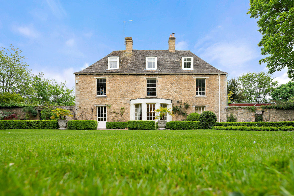 exterior of double fronted georgian home from garden