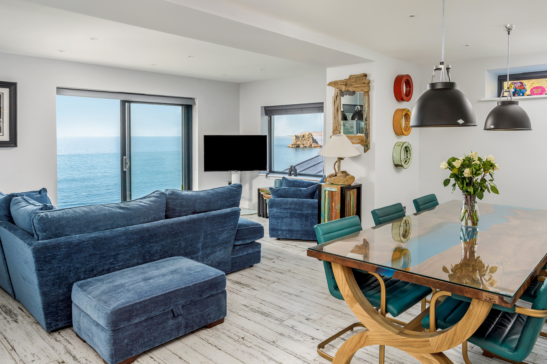 A living room with a view of Cornwall sea
