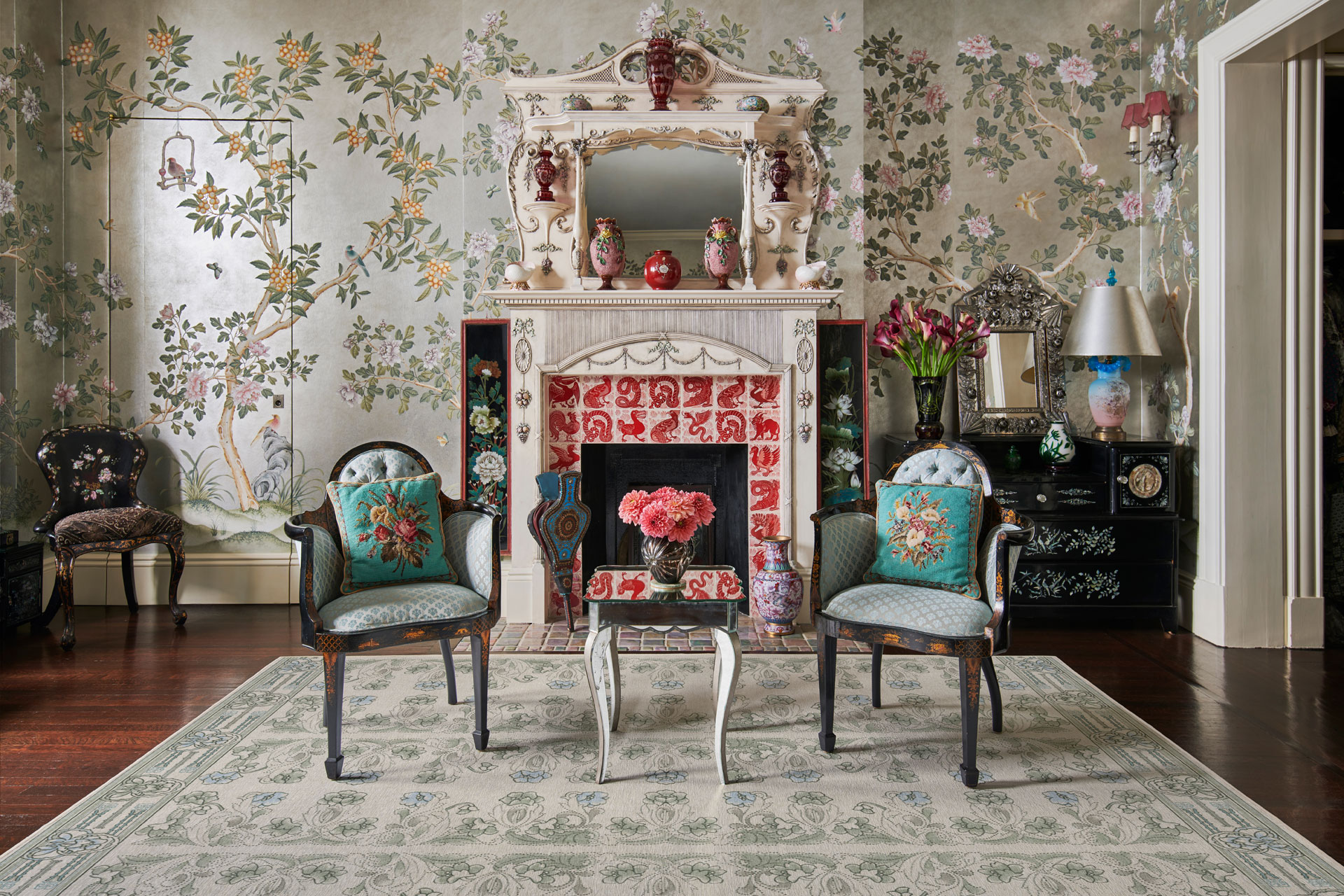 The latest ruggable collaboration with Anna Sui, featuring maximalist rugs, that's in a over the top, Rococo style room with Degournay wallpaper