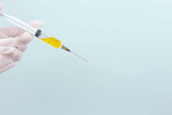 fat banking injection with a pale blue background