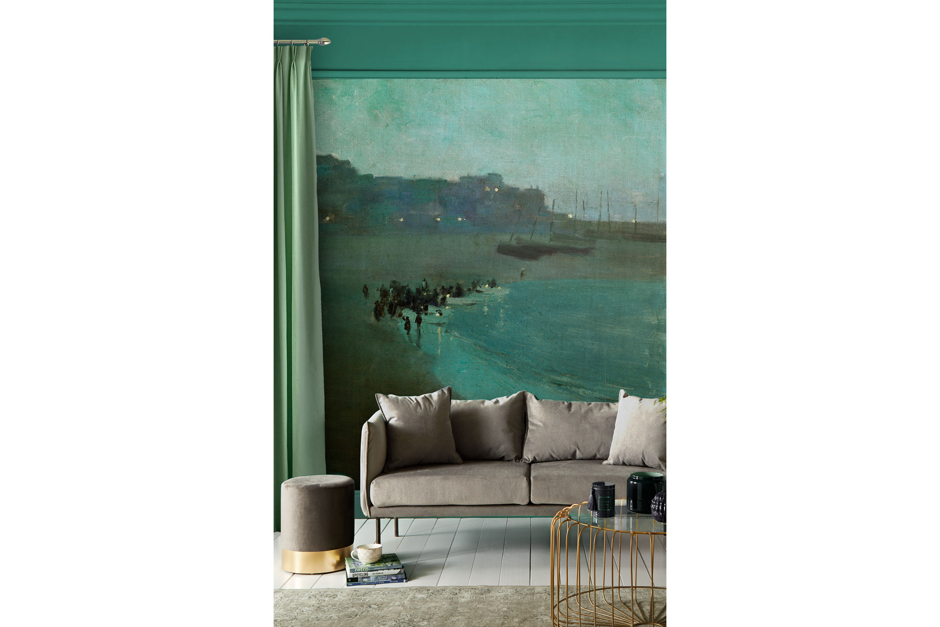 Osborn Beach at Dusk mural wallpaper behind a grey sofa in a living room