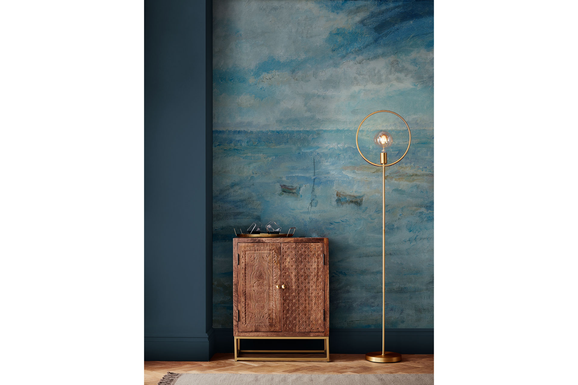 Walker Seascape Bespoke Mural with a lamp and wooden bedside table out in front