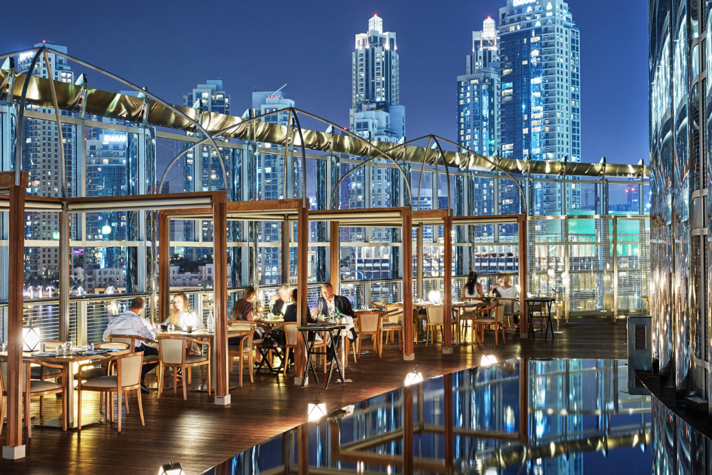 Armani glitzy terrace at night with cityscape background at night