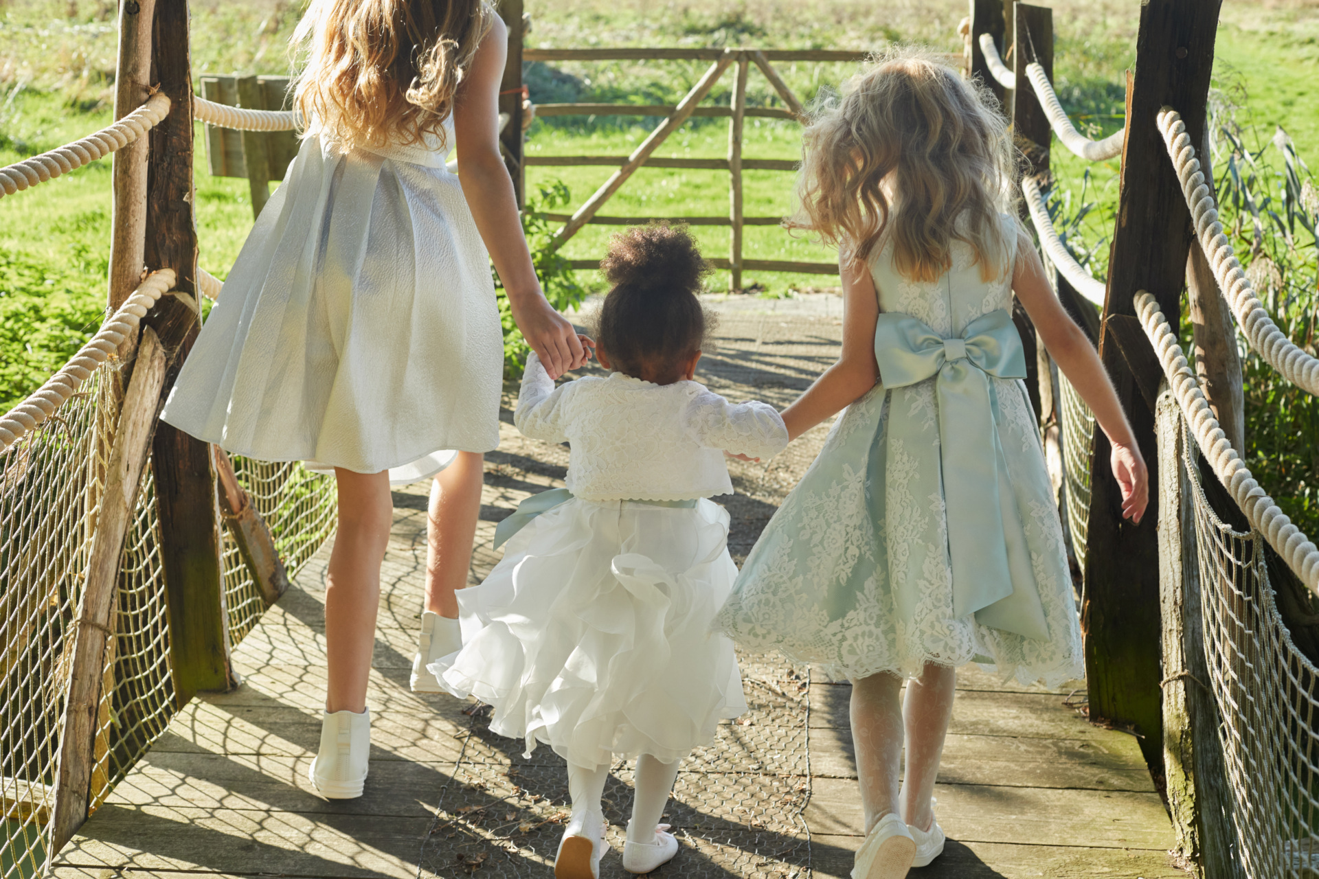 Flower girls in white and blue dresses