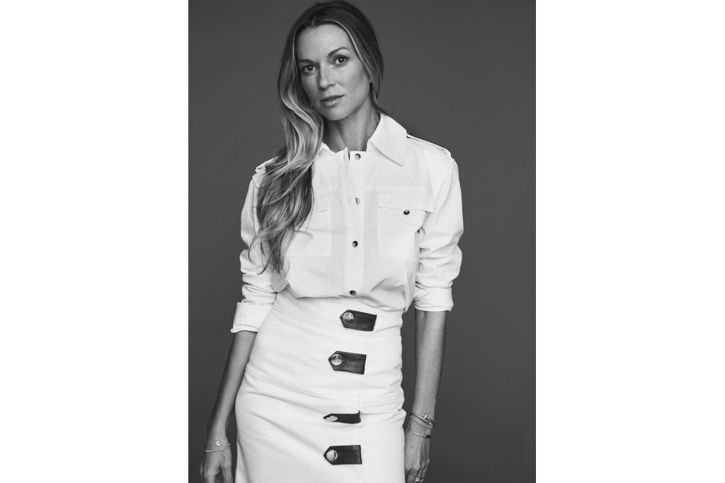 black and white shot of Caroline Massenet in white shirt tucked into pencil skirt