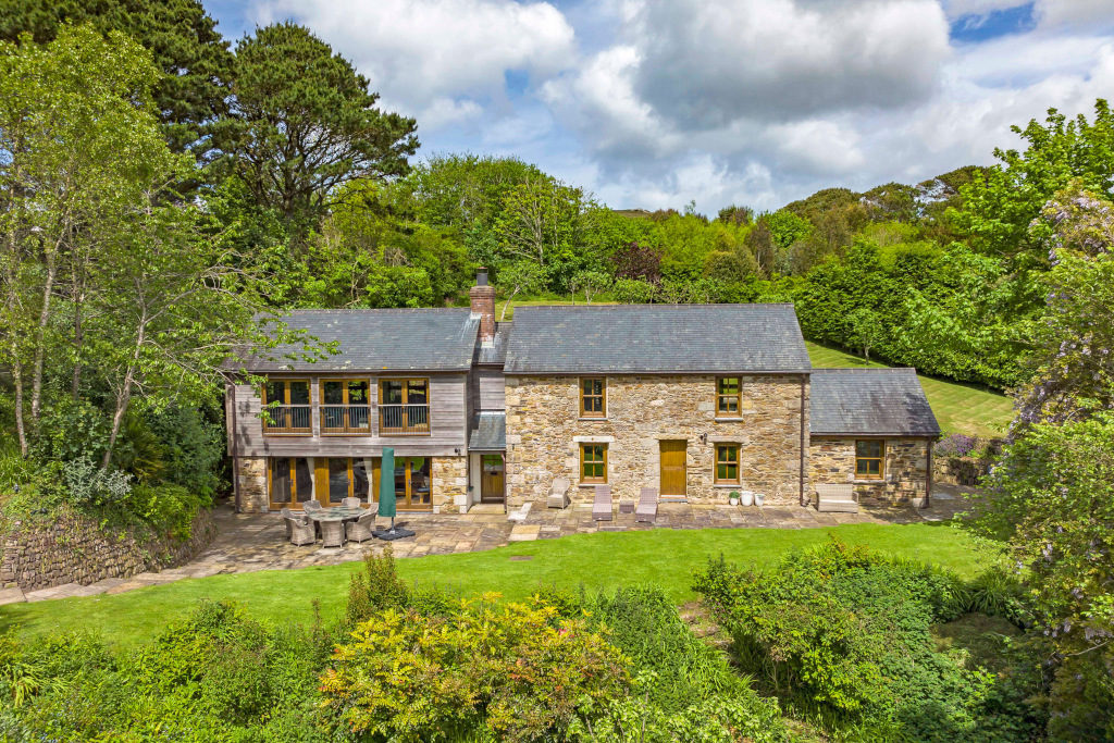sandstone farm house exterior in countryside
