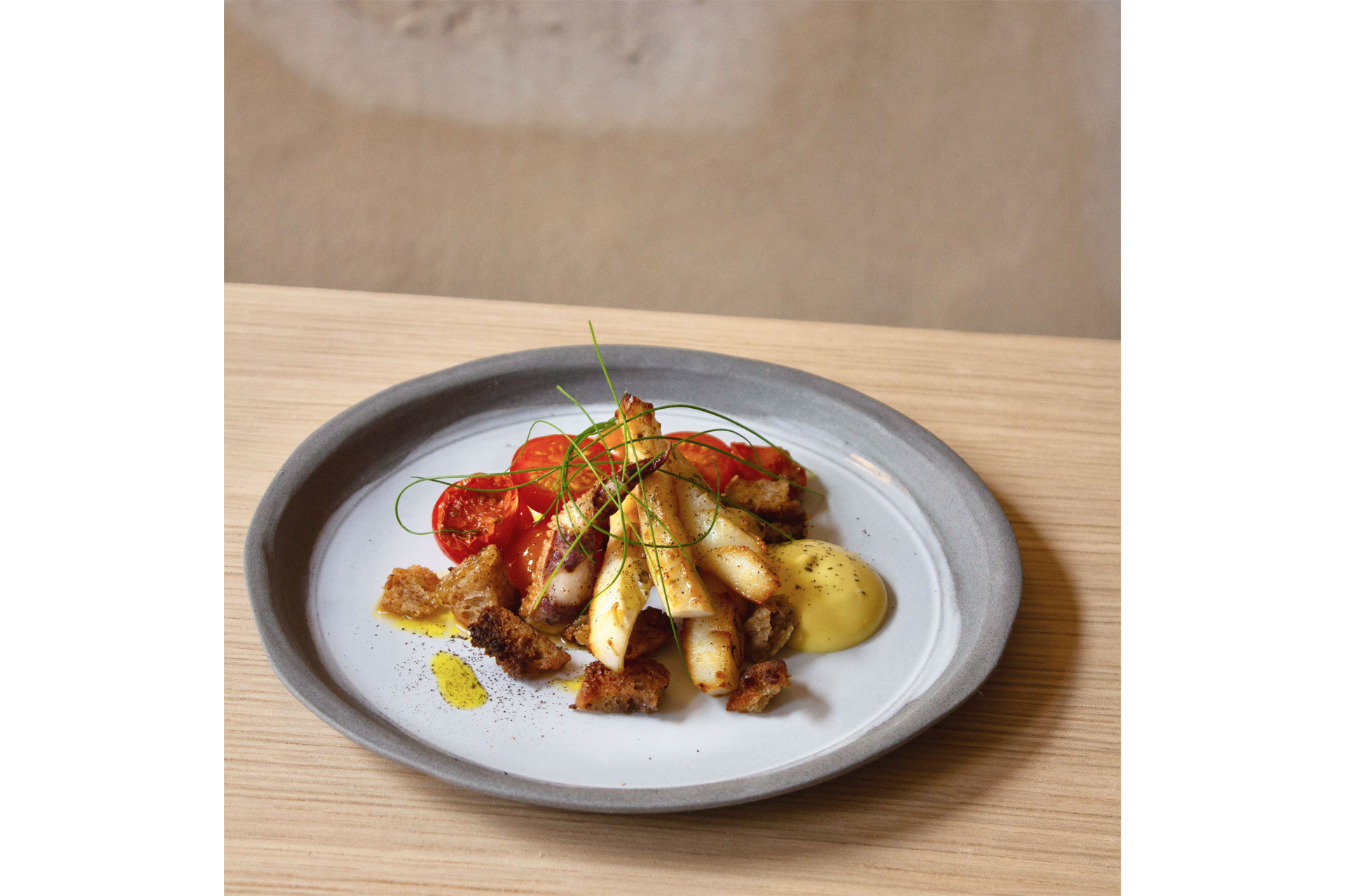 Newlyn cuttlefish, chilli tomatoes, smoked emulsion and pork touille. 