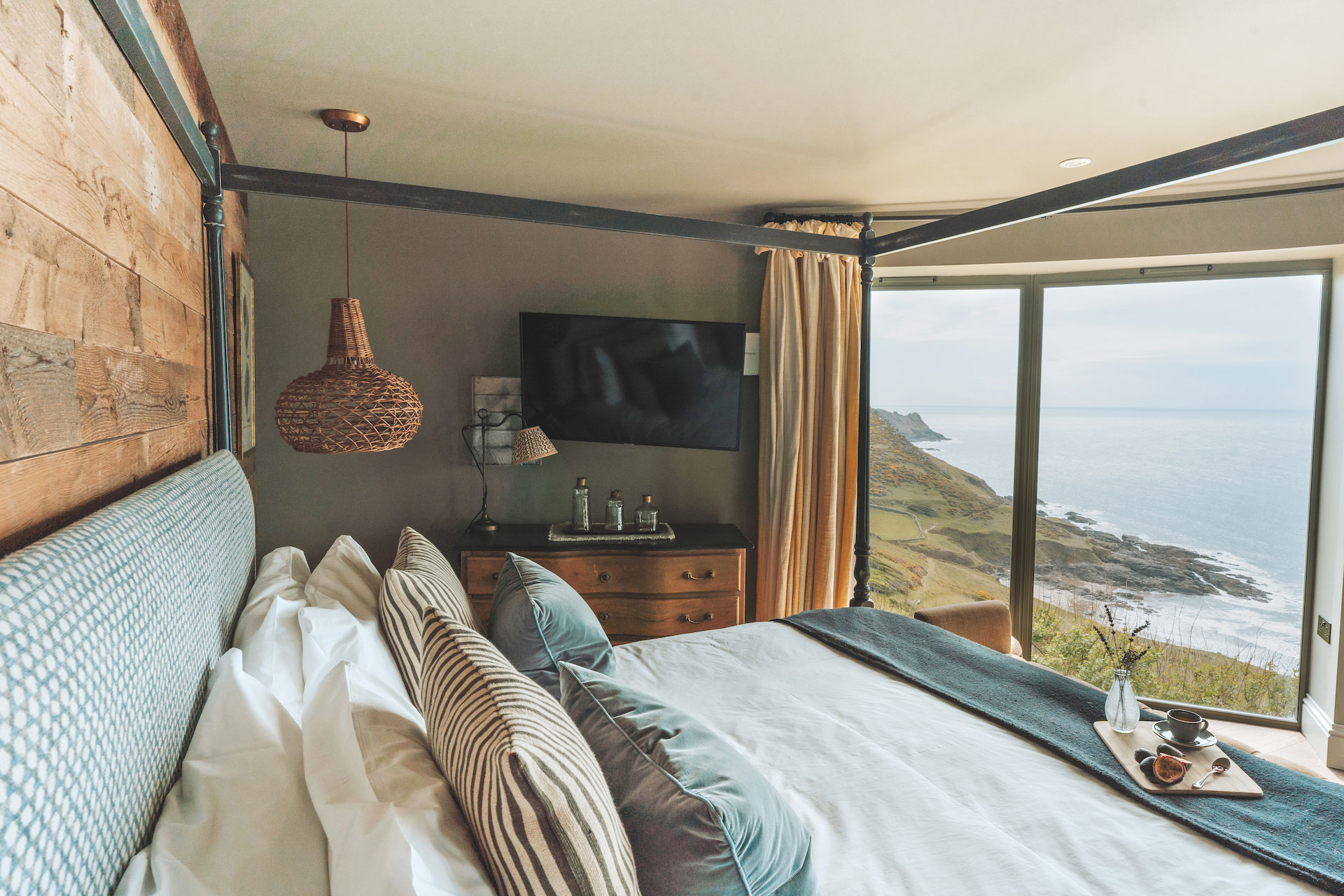 Gara Rock bed and view from window of penthouse Devon hotels