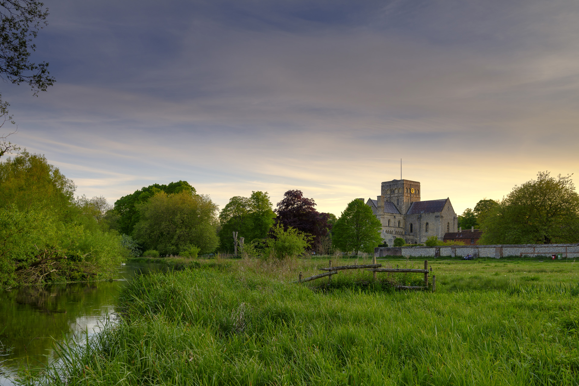 Spring sunset over St Cross Hospital and the River Itchen in Winchester, Hampshire, UK