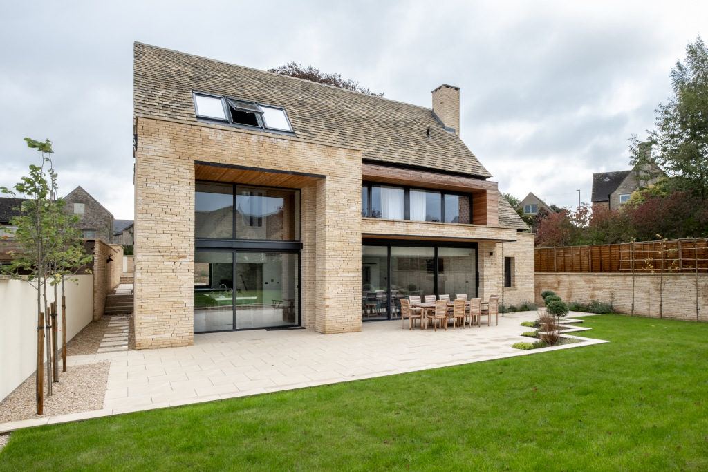 modern house with big windows exterior shot from garden