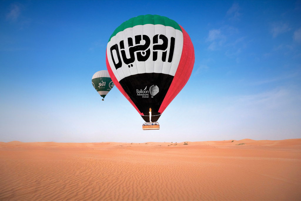 dubai flag Hot air balloon over desert