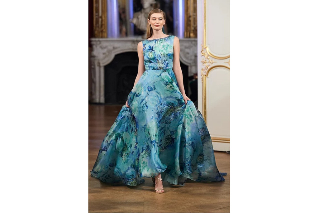 Model in A-line blue floral patterned gown