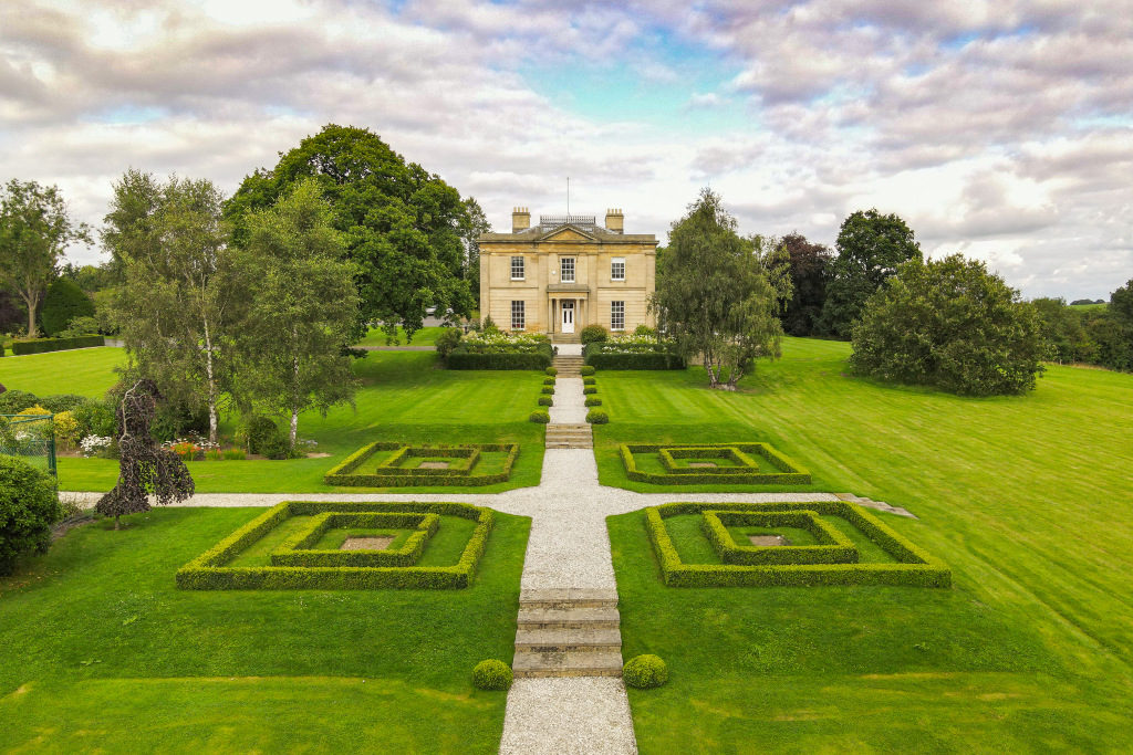 exterior shot of georgian manor house, Oaklands Manor, and its grounds, in Leeds