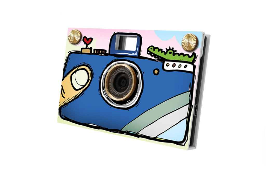 Paper camera with hand drawing on the front of blue camera, thumb and crocodile