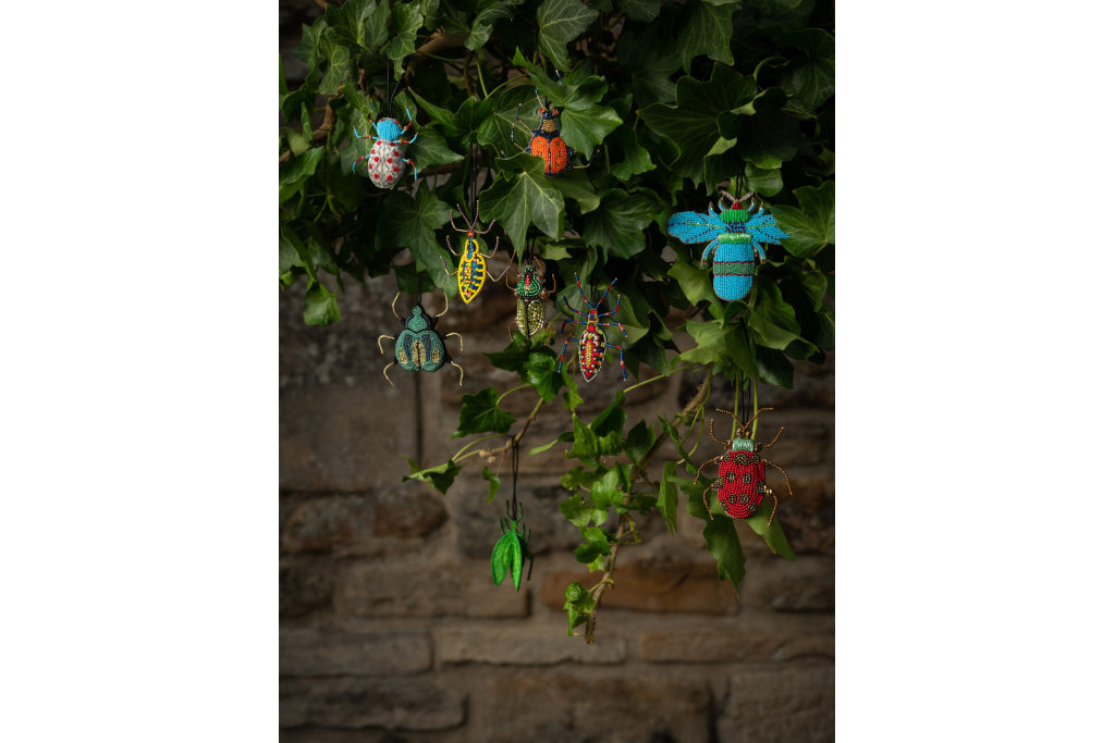 Tree with hanging multicoloured beaded beetles