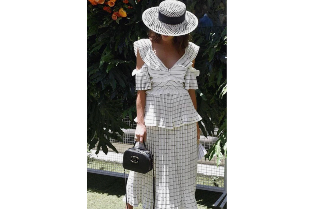 Woman in white striped dress