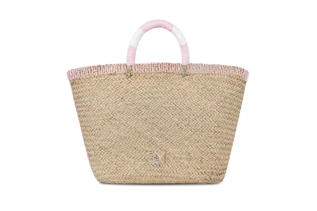 Woven bag with pink handles