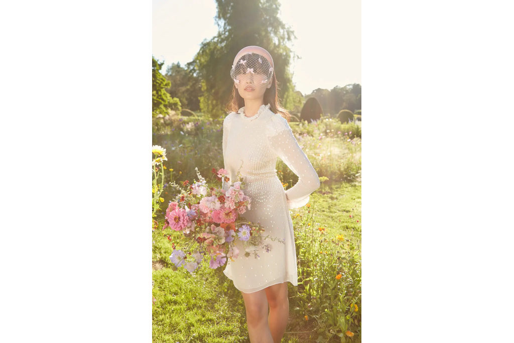 Woman in short wedding dress in a garden
