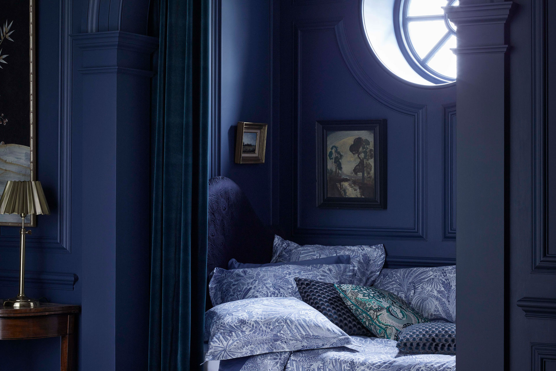 a dark blue bedroom by Liberty, with liberty bedding
