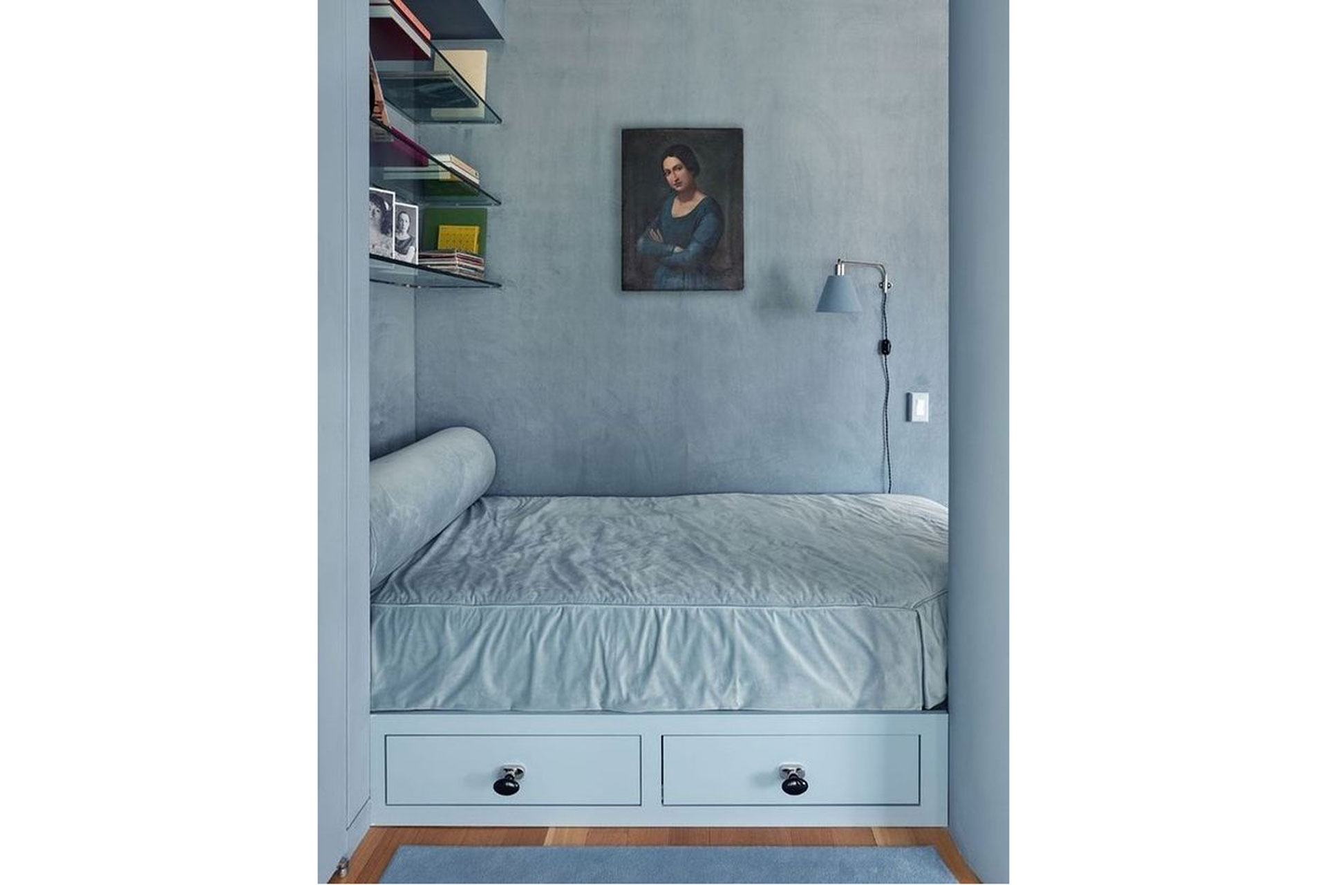 a blue bedroom with a painting in the centre with glass shelves designed by Charlap Hyman & Herrero