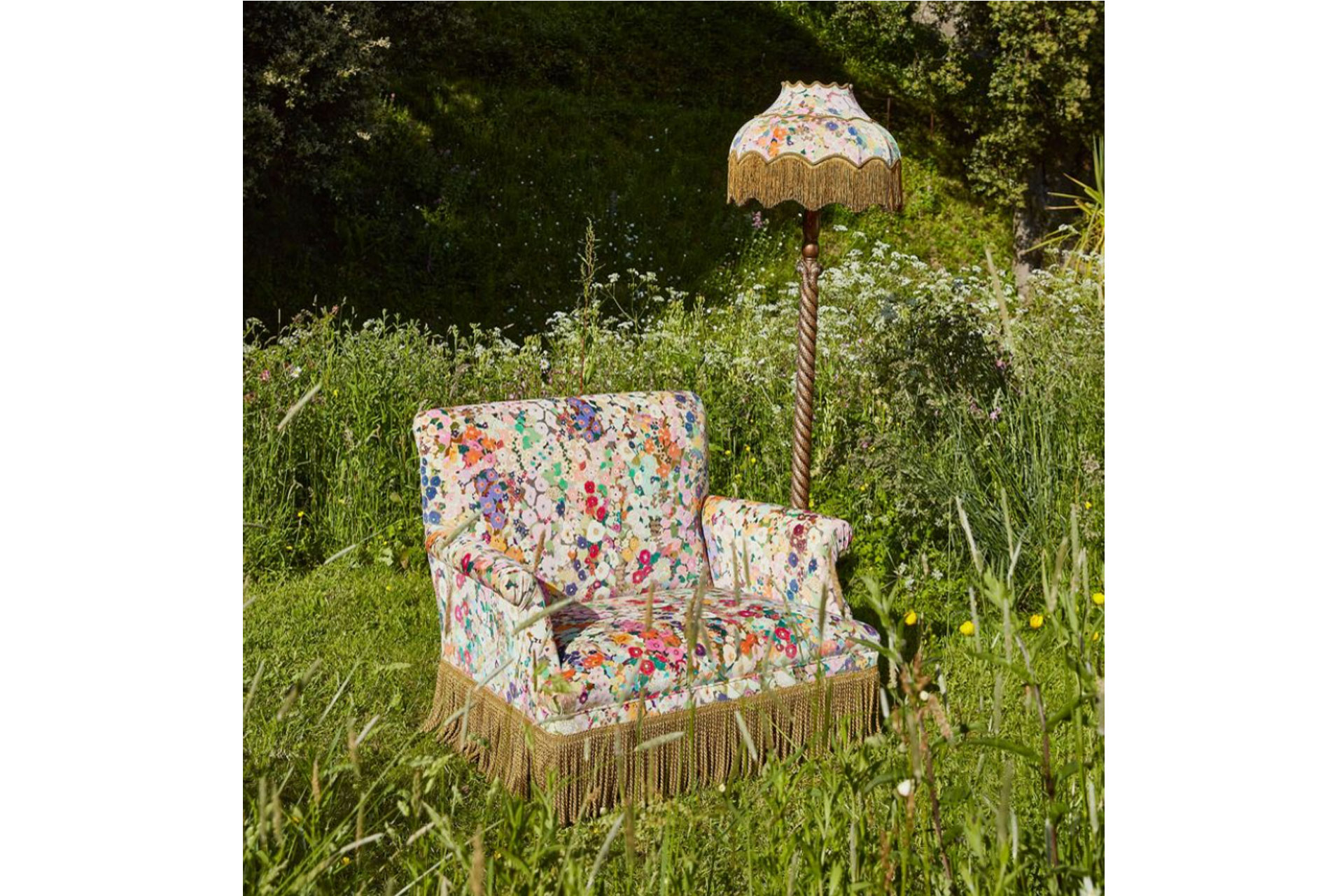 House of Hackney floral armchair and lamp in a field