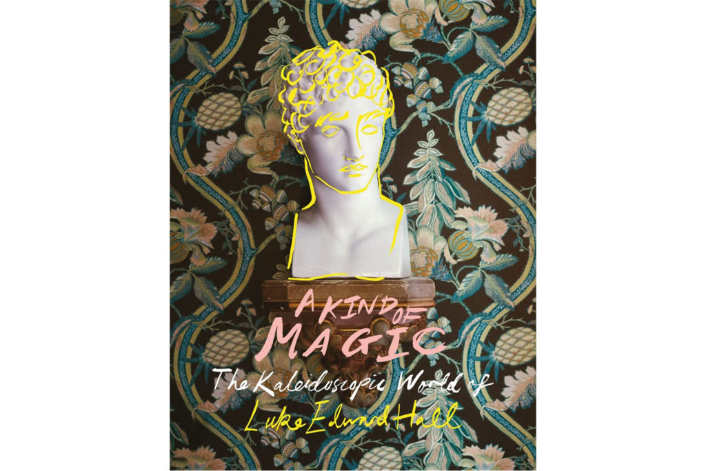 Interior Designer and Artist Luke Edward Hall is publishing a new book, called It's a Kind of Magic, on interior design, that's out this November 2022, the cover features a bust, and a maximalist wallpaper behind