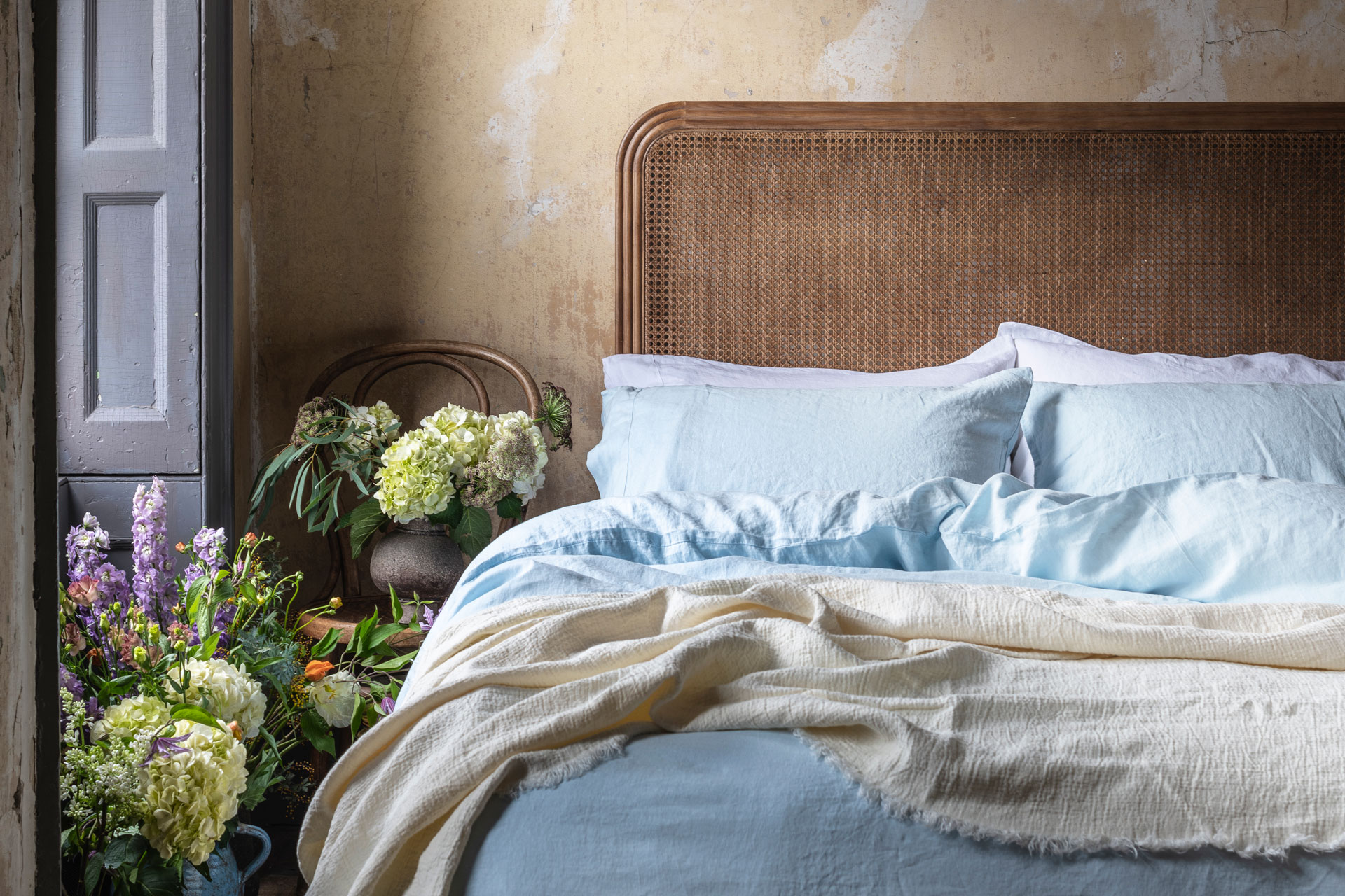 blue linen bedding in a Parisian bedroom, by Piglet in Bed