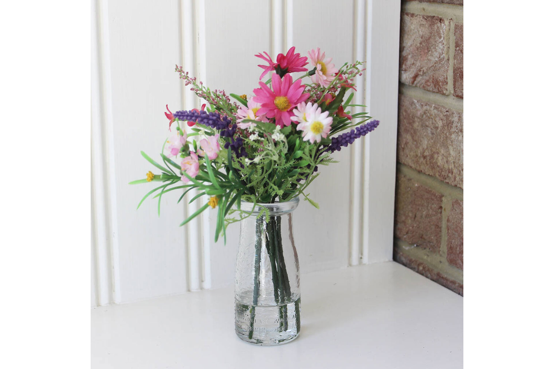 an artificial bouquet of pink and purple flowers, sold by Not on the High Street