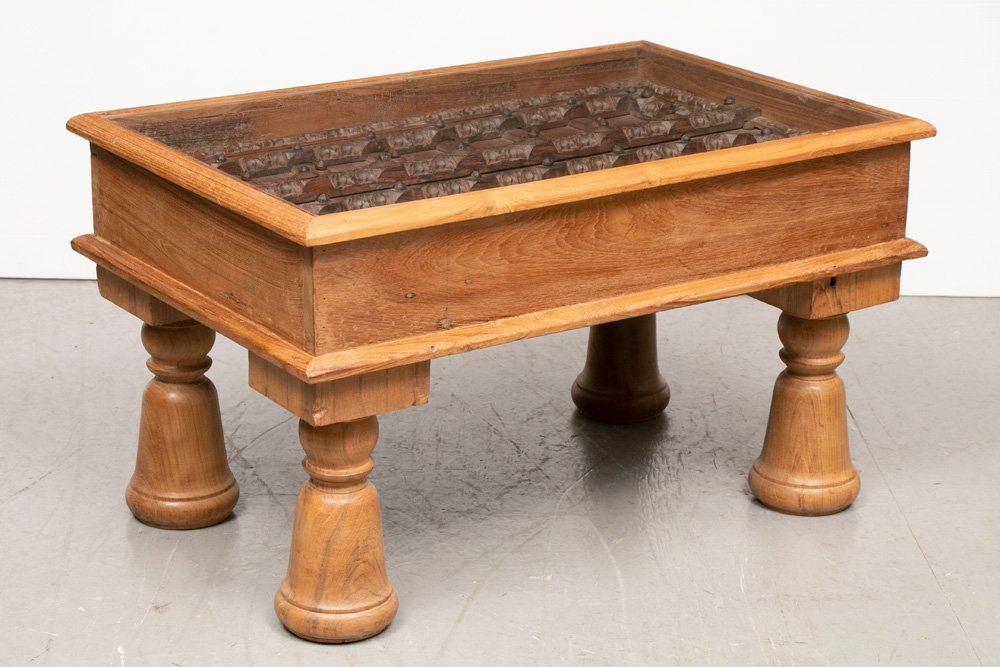 Coffee table containing decorative nineteenth-century window shutters from Rajasthan, £585, theoldcinema.co.uk