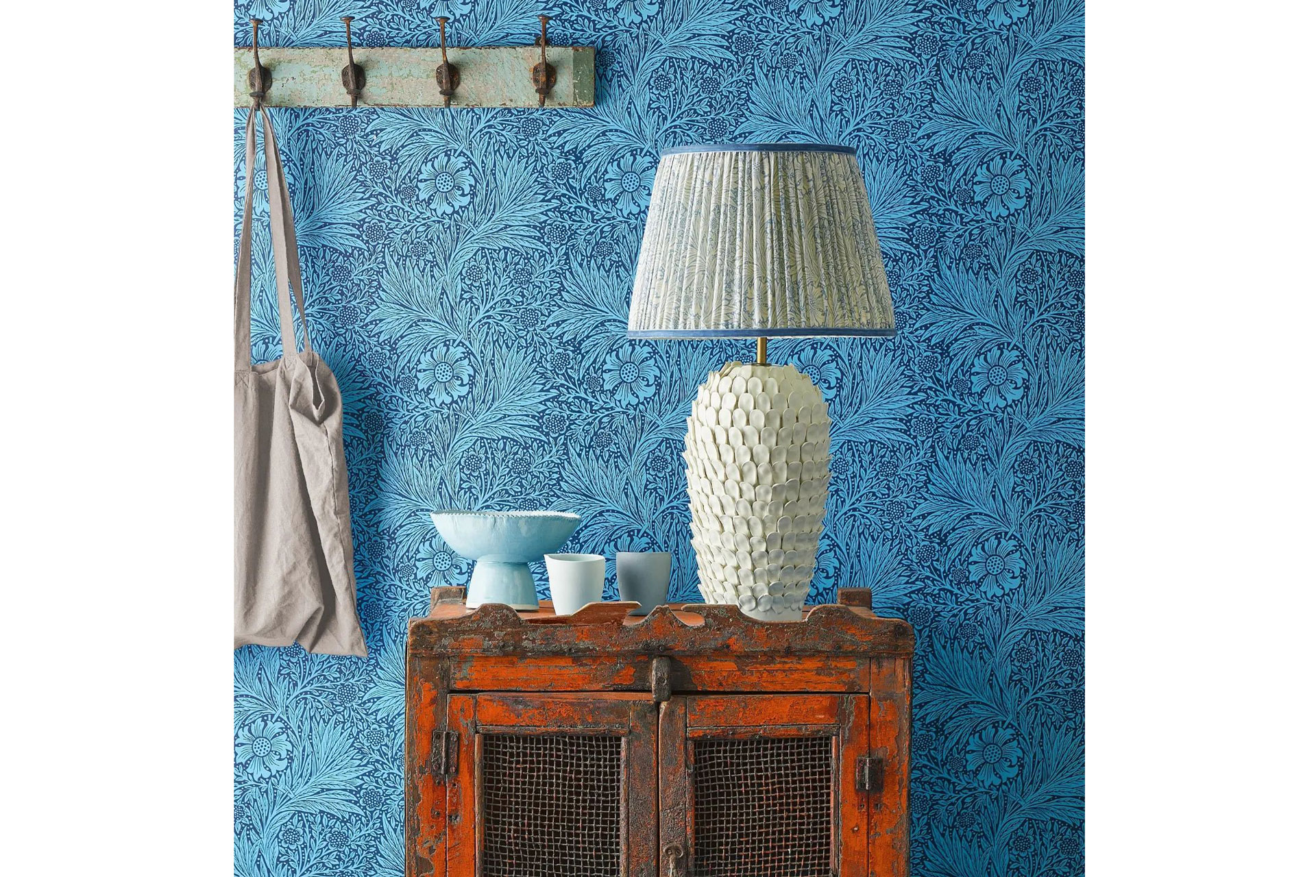 Pooky lamps behind a blue wallpapered entrance hall