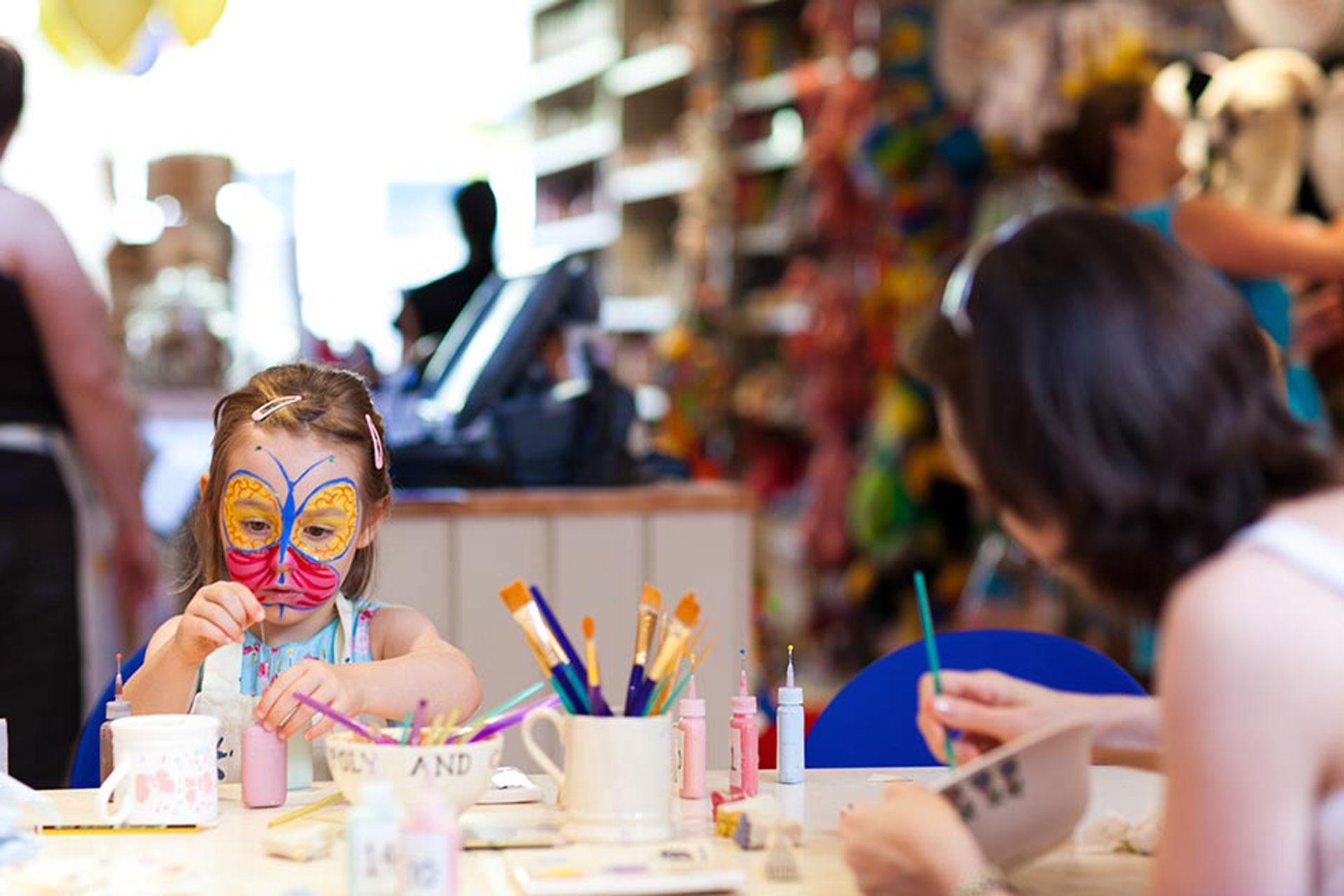 The Pottery Café in Battersea, with a mother and child painting pots