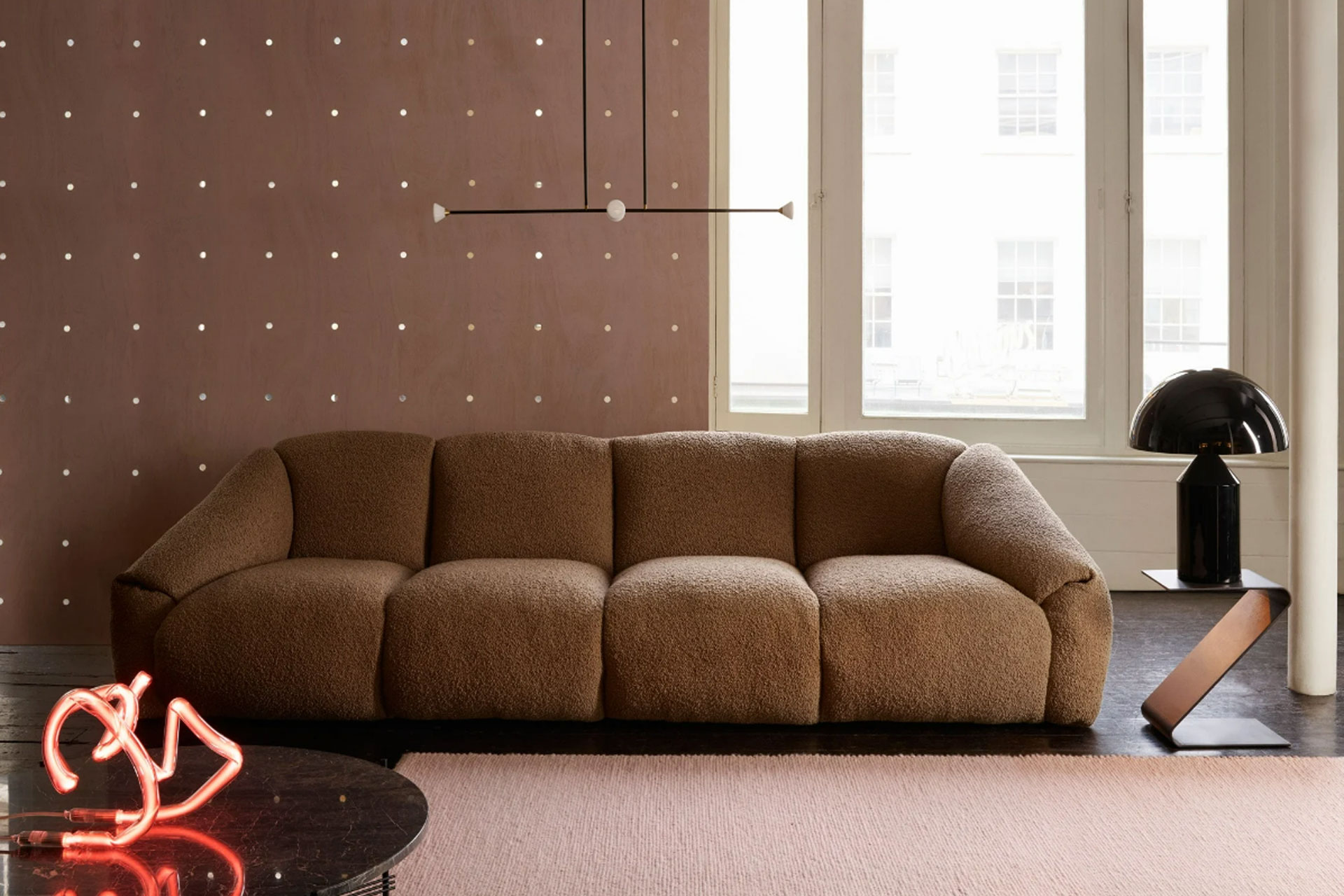 a brown sofa behind a pink wall, by SCP