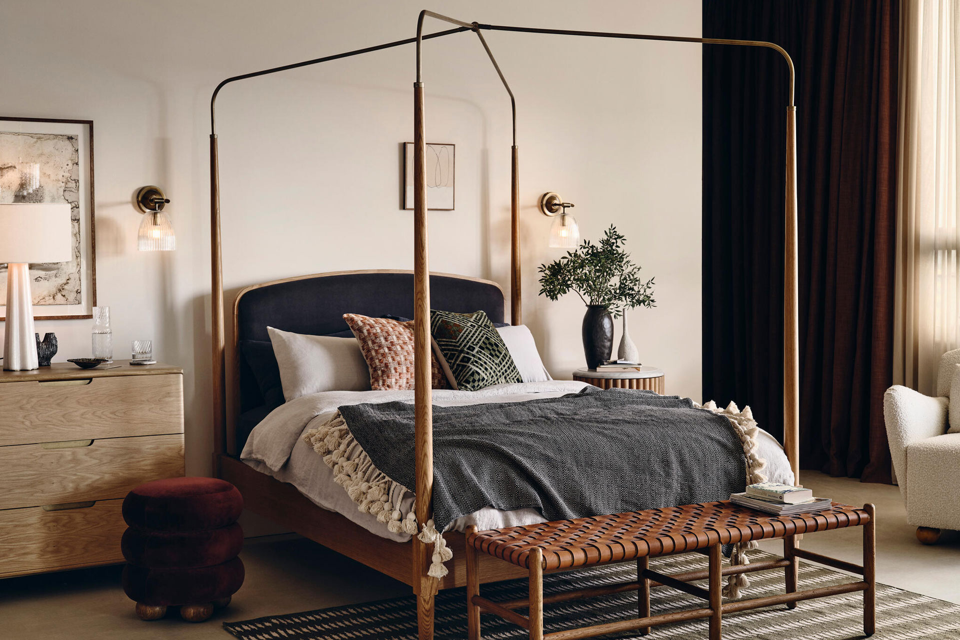 a wooden canopy bed by Soho Home