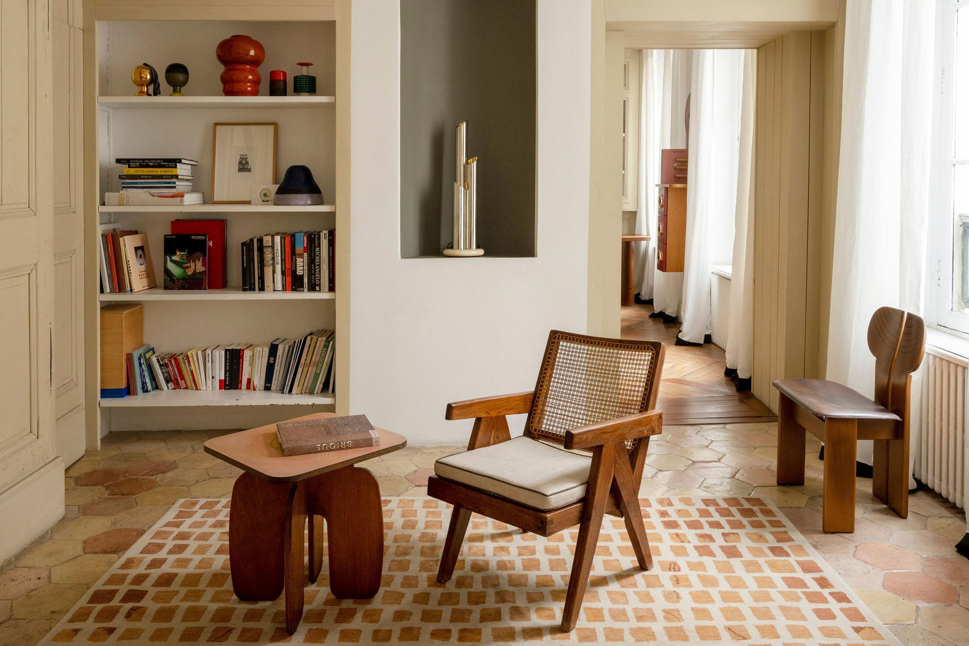 a living room with smart table and chair, sold by The Invisible Collection