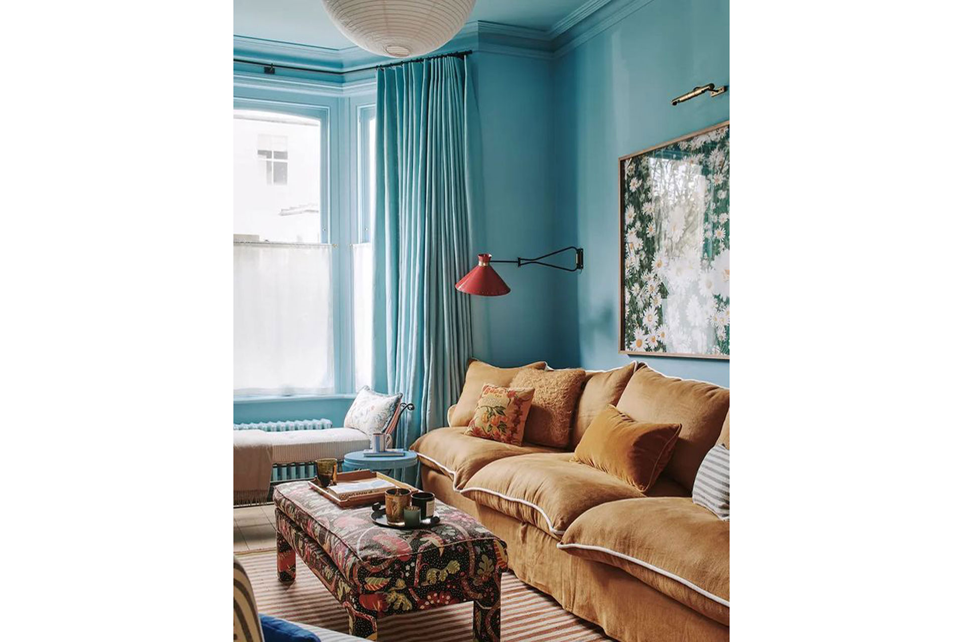 a blue living room with a yellow sofa by East London Cloth