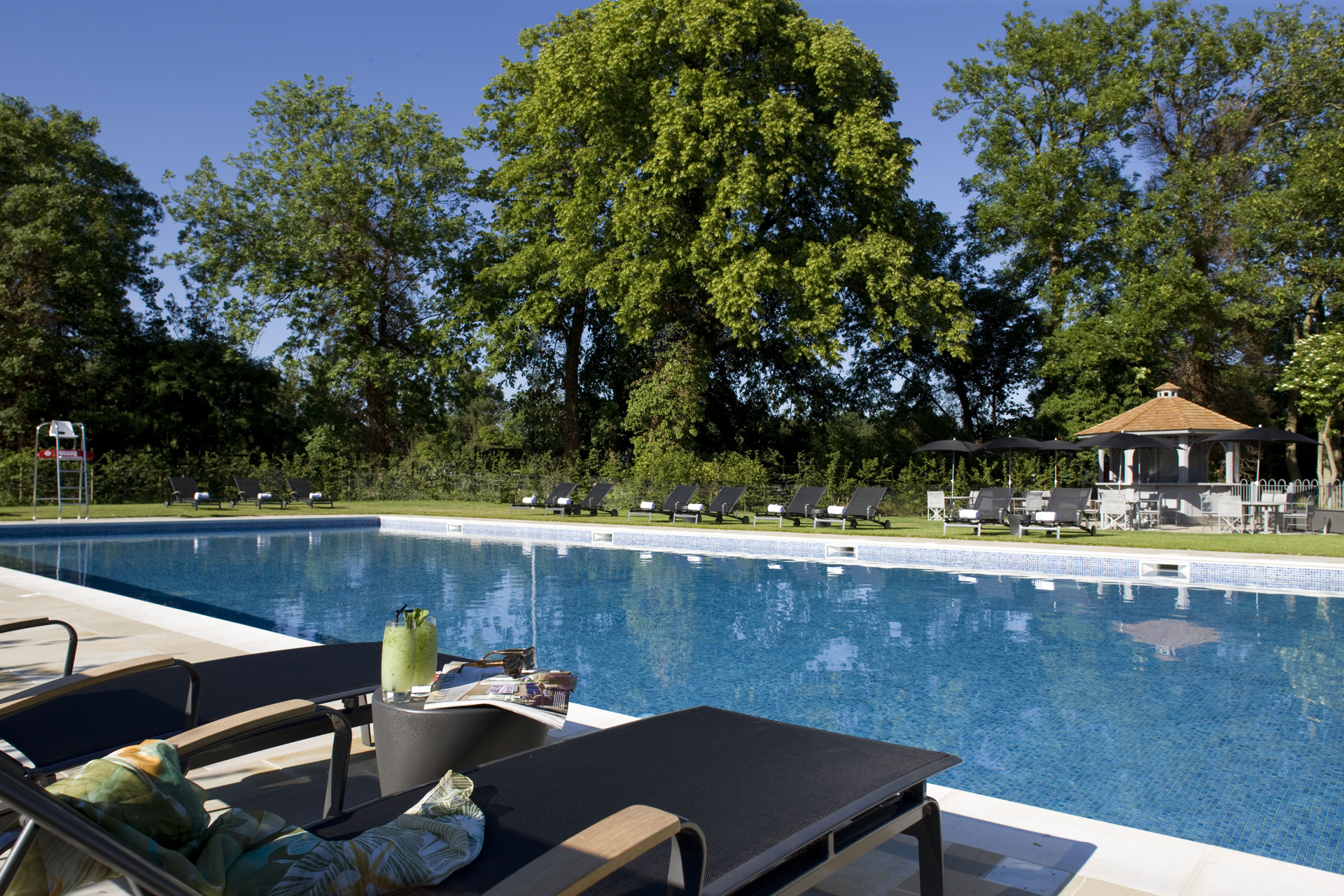 The seasonally heated outdoor swimming pool at The Runnymede on Thames